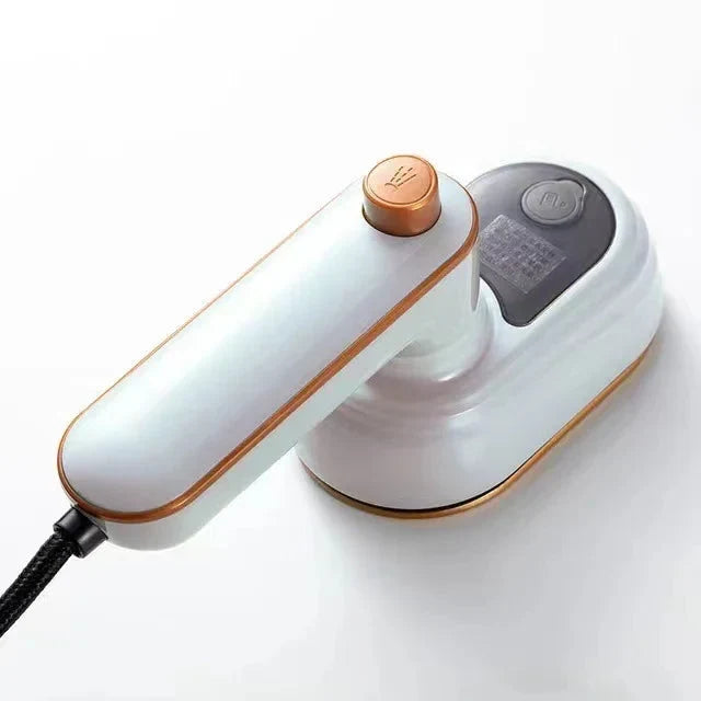 White mini steam iron with dry and steam controls, copper temperature dial, compact handle