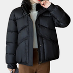 Women’s black puffer jacket with stand collar, front zipper, and quilted front panels